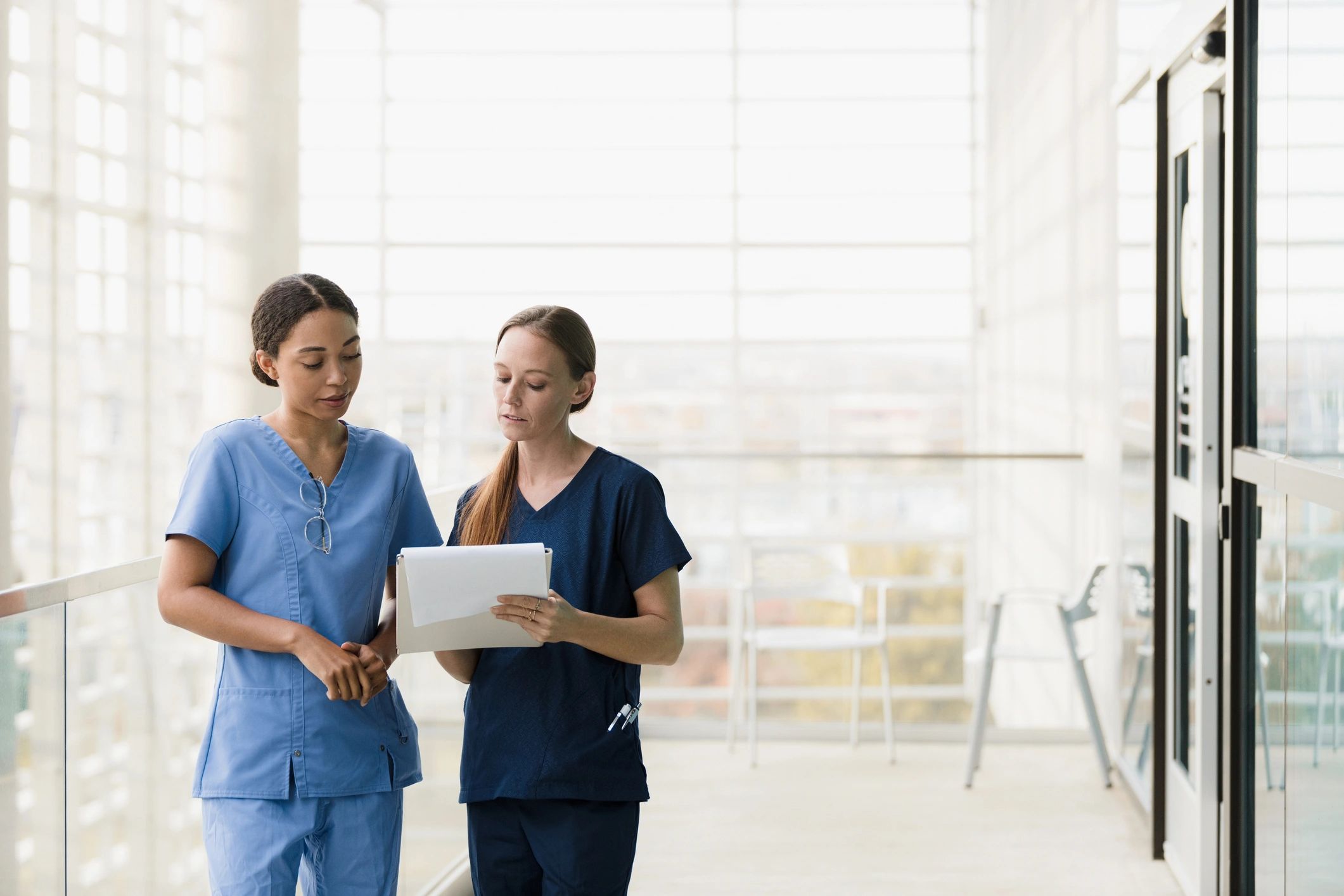 Clinicians reviewing health information during a consultation