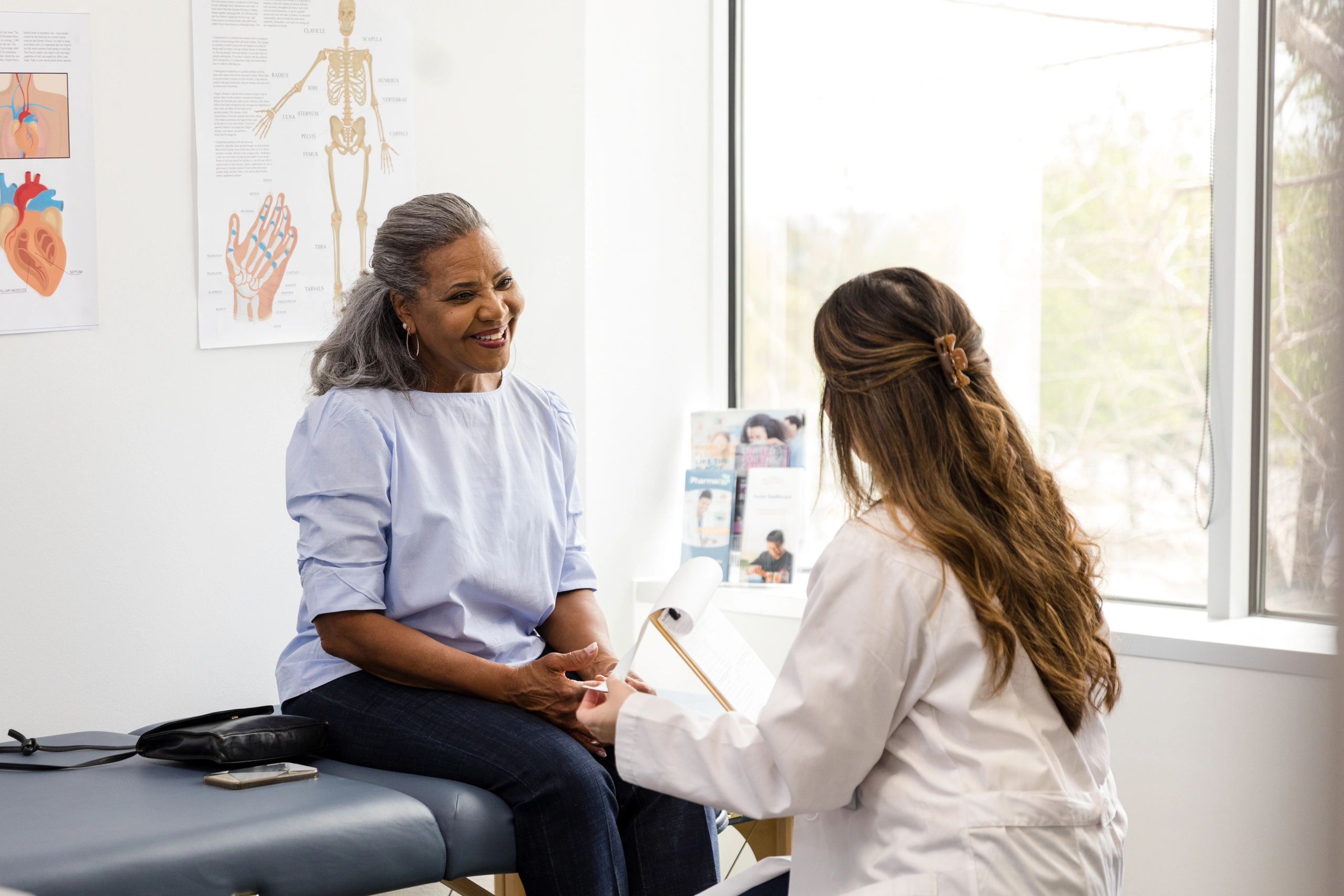 Practitioner speaking with a patient in a clinic setting