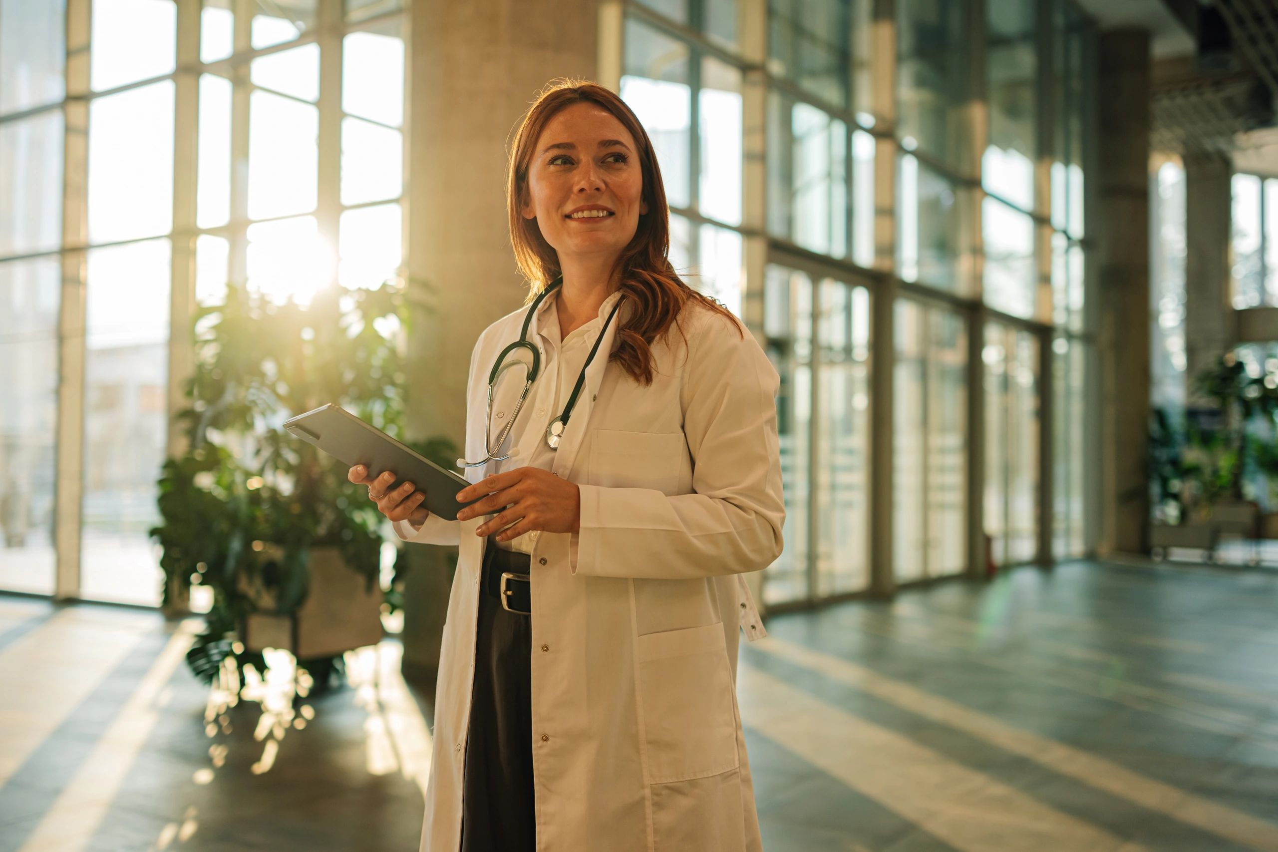 Doctor using a tablet in a modern clinical setting