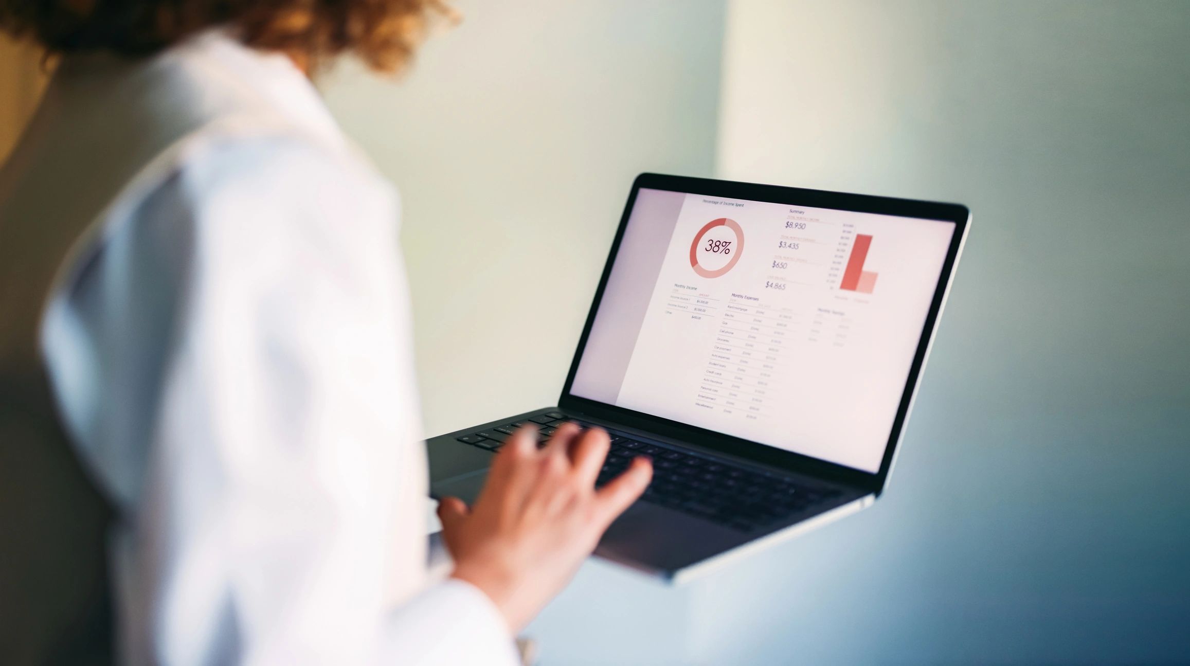 Person reviewing a data dashboard on a laptop